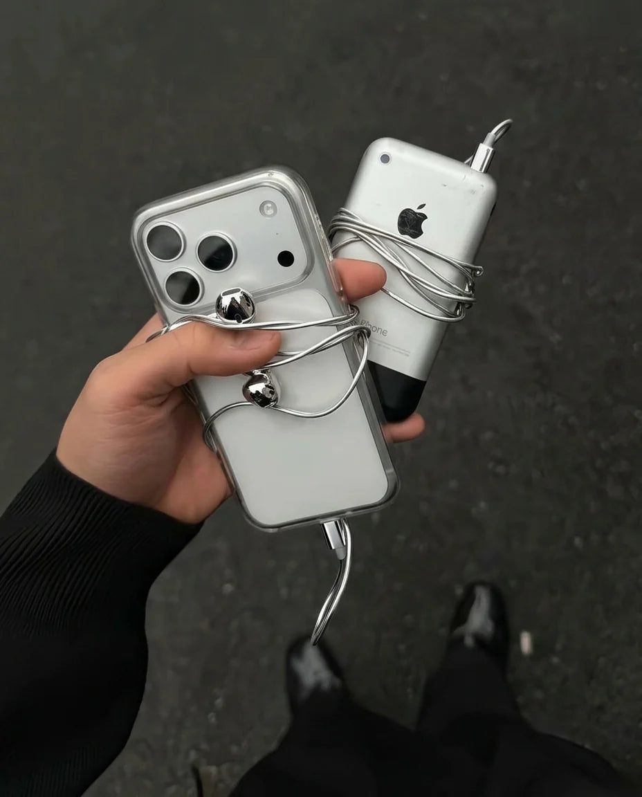 Chrome Buds wrapped around a phone, flat lay