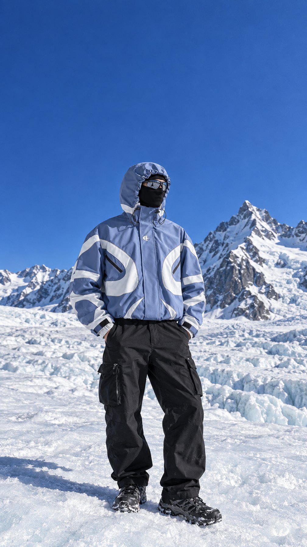 Two people in Vapor Tech windbreakers on a glacier in low sun